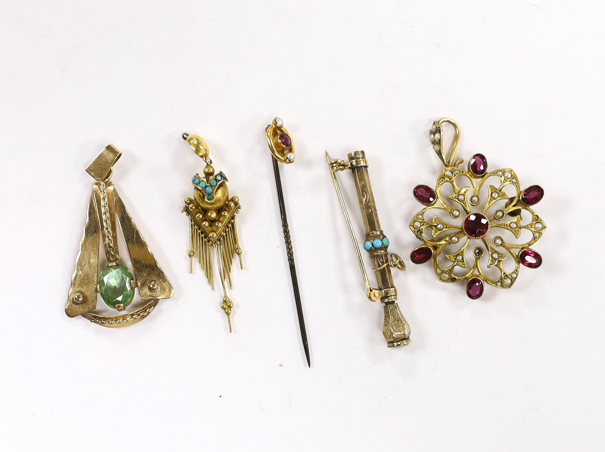 An early 20th century 9ct, garnet and seed pearl cluster set pendant, diameter 32mm, a yellow metal and gem set stylised pendant, a Victorian yellow metal and turquoise set tassel earring, a 9ct and gem set stick pin and